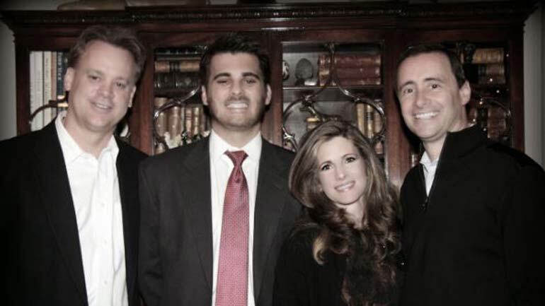 Ryan Poston, second from left, with his parents