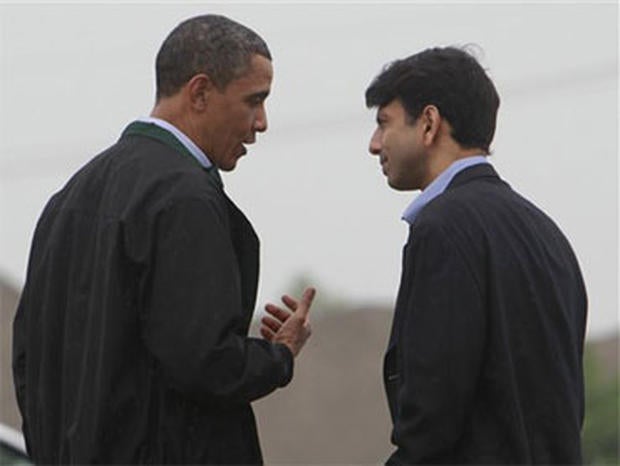 President Barack Obama is greeted by Louisiana Gov. Bobby Jindal, right, as he arrives at Louis Armstrong International New Orleans Airport en route to the Gulf Coast region where he will visit damage caused by the BP oil well spill, Sunday, May 2, 2010.