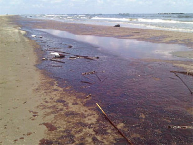 The beach at Grand Isle Beach, La., covered in oil, Friday, May 21, 2010.