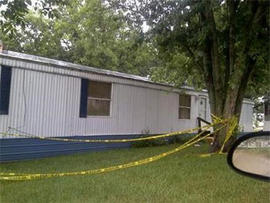 Outside of home where 12-year-old is accused of murdering his parents (KRCG)