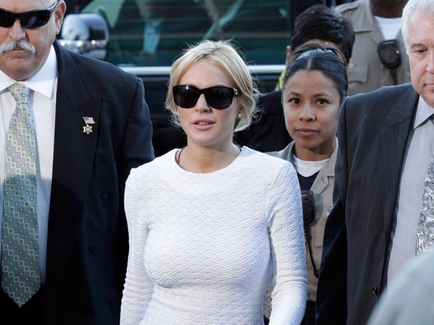 ctress Lindsay Lohan, center, arrives at the LAX Airport Courthouse in Los Angeles