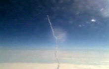 Shuttle launch seen from plane window