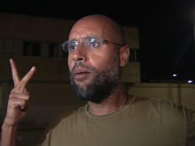 Qaddafi's son makes appearance after alleged arrest