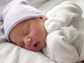 Baby Sleeping in White