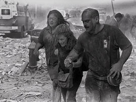 People walk through dust and debris from collapse of World Trade Center