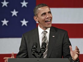 President Barack Obama sings before speaking