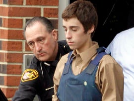 Seventeen-year-old TJ Lane is led from Juvenile Court by sheriff's deputies in Chardon, Ohio, Feb. 28, 2012, after his arraignment in the shooting of five high-school students.