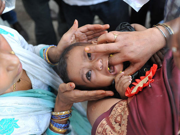 Indian Believers Swallow Live Fish As Asthma Cure Photo Pictures Cbs News