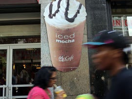 A sign for a large sweetened drink