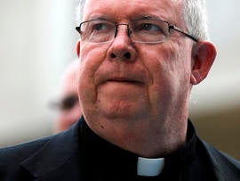Monsignor William Lynn walks to the Criminal Justice Center June 19, 2012, in Philadelphia.