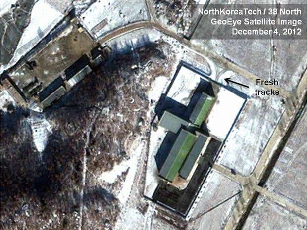 Dec. 4, 2012 satellite image taken by GeoEye and annotated and distributed by North Korea Tech and 38 North shows snow covering the Sohae launching station in Tongchang-ri, North Korea, including the path where trailers would be used to move the rocket stages from the assembly building to the launch pad in preparation for a Dec. 10-22 launch. New satellite images show that heavy snowfall may have slowed North Korean rocket launch preparations but that Pyongyang could still be ready for liftoff starting Monday, Dec. 10, 2012. This image was shared with the AP by the 38 North and North Korea Tech websites, which collaborate on analysis of the satellite imagery.