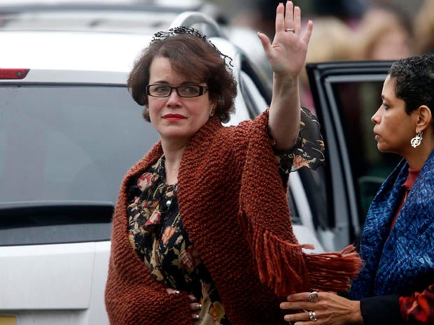Veronika Pozner waves to the assembled press as she leaves after a funeral service for her son, 6-year-old Noah Pozner, Dec. 17, 2012, in Fairfield, Conn.