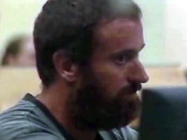 Joshua Michael Hakken is processed for booking into the Hillsborough County Jail in Tampa, Fla., early April 10, 2013, in this framegrabbed image provided by Baynews9.