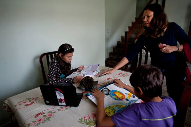 Adela Cavalcante talking to her children in Iraja, Brazil