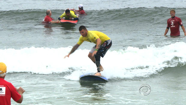 A veteran surfs during a Wounded Warriors event in Breezy Point, N.Y.