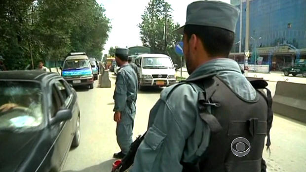 Guards at a checkpoint in front the U.S. embassy in Yemen, closed until Saturday.