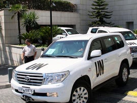 U.N. experts leave a hotel in Damascus, Syria, Aug. 30, 2013.