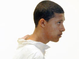 Philip Chism, 14, stands during his arraignment for the death of Danvers High School teacher Colleen Ritzer in Salem District Court in Salem, Mass., Oct. 23, 2013.