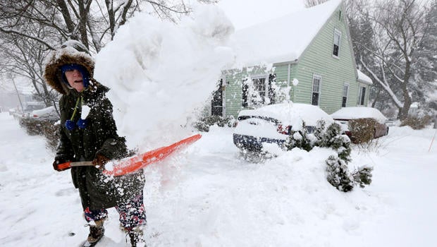 Peggy Udden, of Norwood, Mass., shovels her driveway in Norwood Feb. 5, 2014.