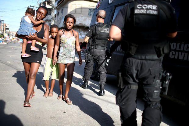 Rio De Janeiro Brazilian Security Forces Raid Rio Slums Ahead Of World Cup Pictures Cbs News