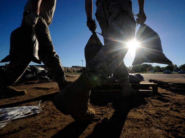 South Dakota National Guard troops fill sandbags in preparation for flooding along the Big Sioux River June 20, 2014, in North Sioux City, S.D.