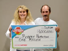 Robert Hamilton and wife Donna Hamilton of Indianapolis are seen after Robert won his second million-dollar lottery prize at Hoosier Lottery's headquarters in Indianapolis July 22, 2014.