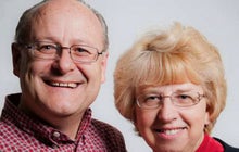 Husband of American Ebola patient says she's improving