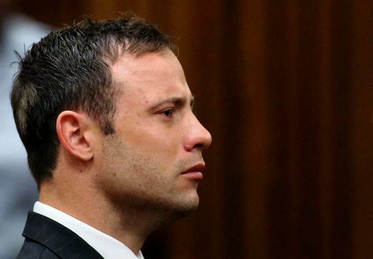 Olympic and Paralympic track star Oscar Pistorius listens to the verdict in his trial
