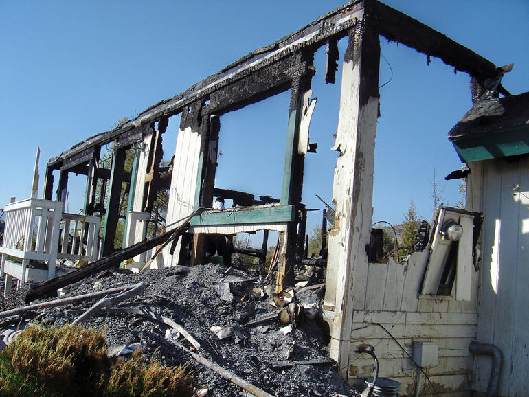 The burned remains of the home in Pinyon Pines, Calif.