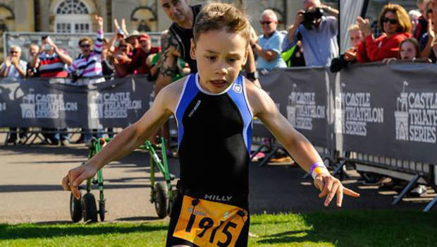8-year-old with cerebral palsy inspires with emotional triathlon finish