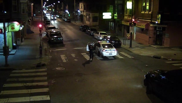 Officer Jesse Hartnett chases after a suspect identified by police as Edward Archer after Hartnett was ambushed in Philadelphia Jan. 7, 2016, in a still taken from police camera footage.