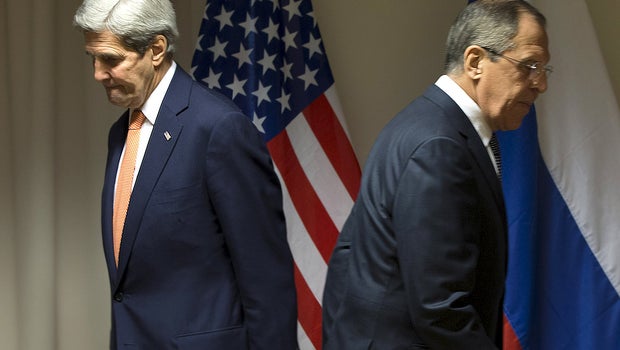 U.S. Secretary of State John Kerry and Russian Foreign Minister Sergey Lavrov walk to their seats for a meeting about Syria in Zurich, Switzerland, Jan. 20, 2016.