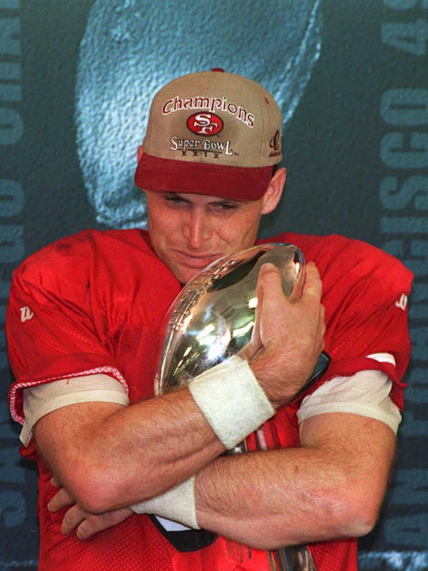 San Francisco 49ers quarterback Steve Young hugs the Vince Lombardi Trophy Jan. 29, 1995, after being named the most valuable player of Super Bowl XXIX.