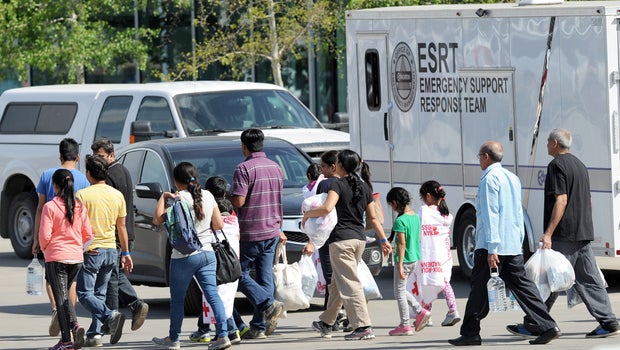 Evacuees from Fort McMurray wildfire leave The Expo Center after receiving supplies in Edmonton, Alberta, on May 4, 2016