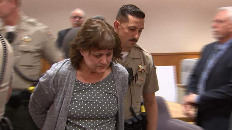 Jane Laut is escorted from the courtroom after the verdict