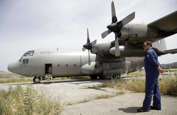 An engineer stands next to a Hellenic Air Force C-130 HAUP aircraft at the 133rd Hellenic Air Force Base in Kasteli on the island of Crete, Greece, May 20, 2016. The plane is participating in a search operation for the missing EgyptAir flight 804 Airbus A320. Credit: Stefanos Rapanis/REUTERS