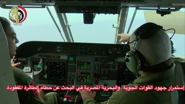 An Egyptian commander points during a hunt operation by Egyptian atmosphere and navy army for a EgyptAir craft that left in a Mediterranean Sea in this still picture taken from video May 20, 2016.
