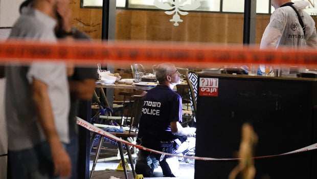 Israeli forensic police inspect restaurant following terror attack in Tel Aviv market on June 8, 2016