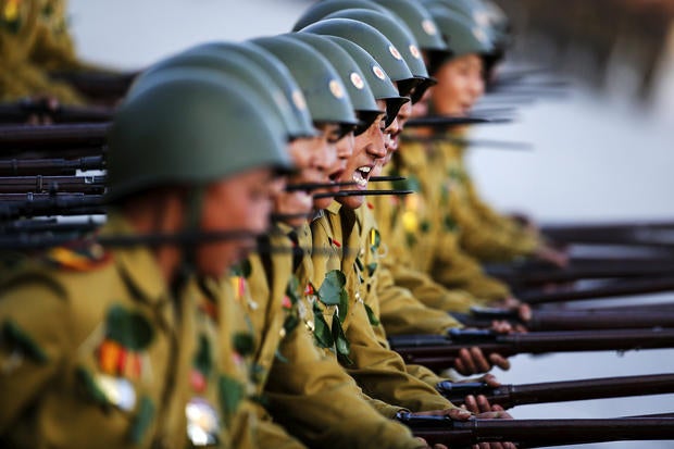 ​Soldiers shout slogans as they march past a stand with North Korean leader Kim Jong Un and other officials during the parade celebrating the 70th anniversary of the founding of the ruling Workers' Party of Korea, in Pyongyang Oct. 10, 2015.