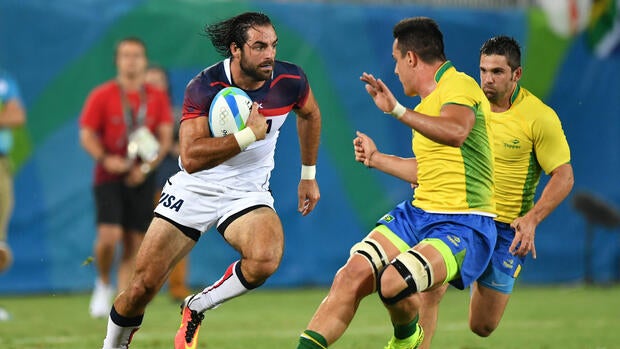 USA's Nate Ebner runs with the ball in the men's rugby sevens match between USA and Brazil during the Rio 2016 Olympic Games at Deodoro Stadium in Rio de Janeiro on Aug. 9, 2016.