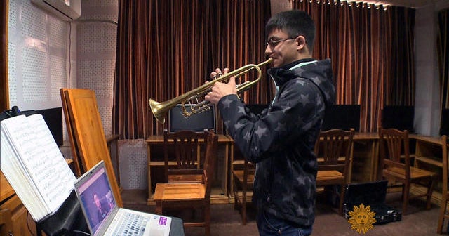 Tooting his own horn Videos CBS News