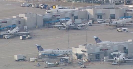 Police investigating after woman exits plane while it's taxiing in Houston - CBS News