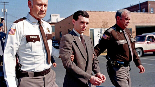 Convicted killer Donald Harvey, center, is led back to jail by Laurel County, Ky., Sheriff Floyd Brummett, left, and an unidentified deputy after pleading guilty to eight murder charges and one voluntary manslaughter charge in London, Ky., on Nov. 2, 198