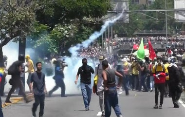 Protesters clash with government forces in Venezuela