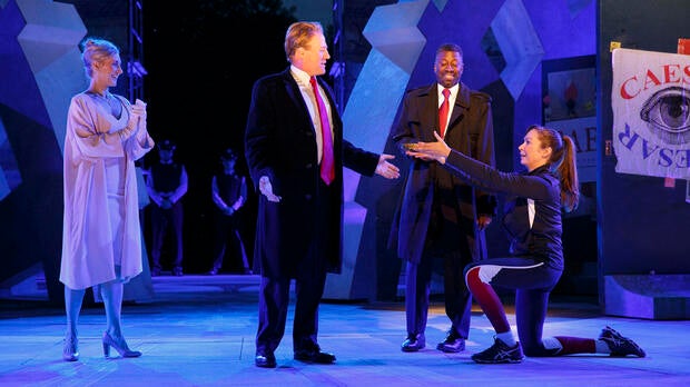 Tina Benko, left, portrays Melania Trump in the role of Caesar's wife, Calpurnia, and Gregg Henry, center left, portrays President Trump in the role of Julius Caesar during a dress rehearsal of The Public Theater's Free Shakespeare in the Park production