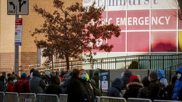 People line up early in the morning to be tested for coronavirus disease (COVID-19) outside Elmhurst Hospital Center in the Queens borough of New York