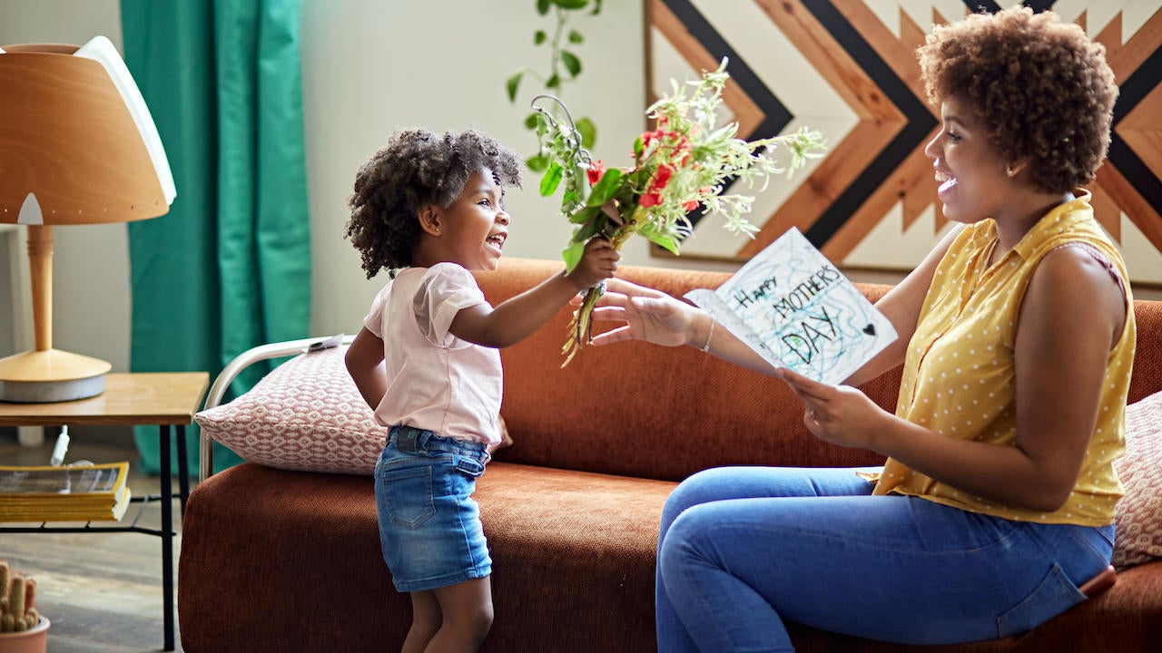 child giving mother mother's day gift 