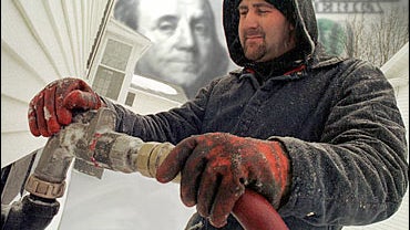 Worker delivers home heating oil 