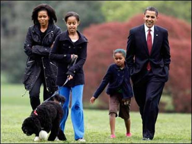 Malia Obama walks with new dog Bo, followed by President Barack Obama, Sasha Obama and first lady Michelle Obama on the South Lawn at the White House in Washington, Tuesday, April 14, 2009. 