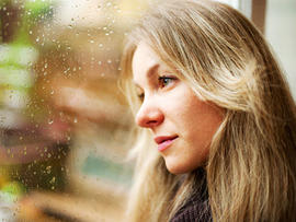 woman, sad, window, seasonal affective disorder, istockphoto, 4x3